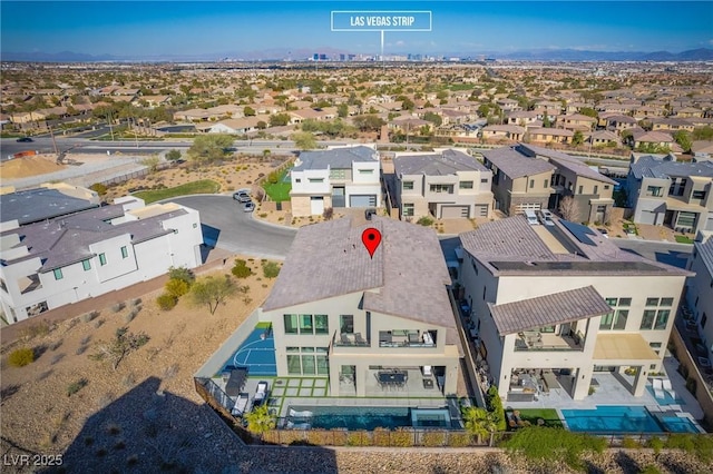 birds eye view of property with a residential view