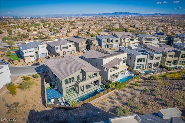 drone / aerial view featuring a residential view and a mountain view