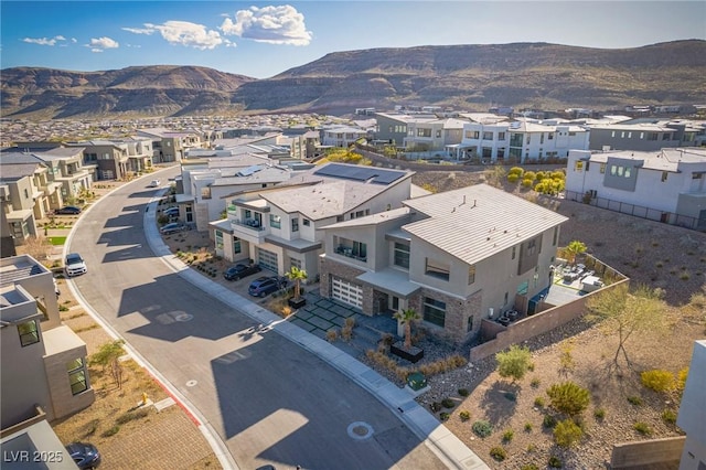 bird's eye view featuring a residential view and a mountain view