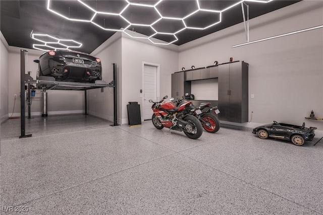 garage featuring baseboards