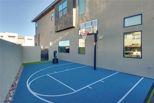 view of sport court with community basketball court and fence