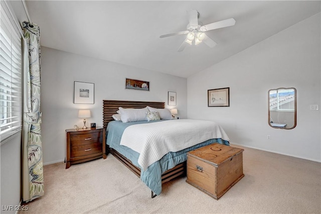 carpeted bedroom featuring vaulted ceiling and ceiling fan