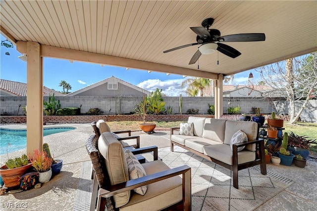 view of patio / terrace featuring ceiling fan, outdoor lounge area, and a fenced in pool