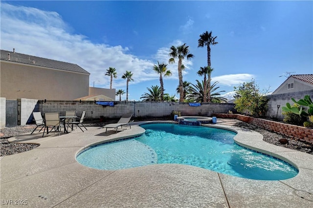 view of swimming pool with a patio and an in ground hot tub