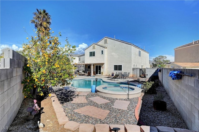 view of swimming pool with a patio area and an in ground hot tub