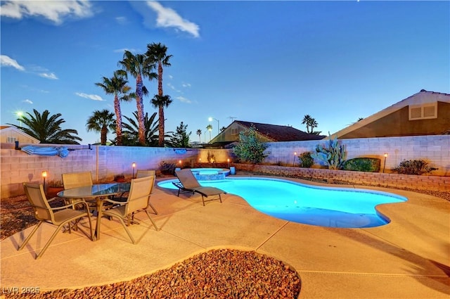 view of pool featuring an in ground hot tub and a patio