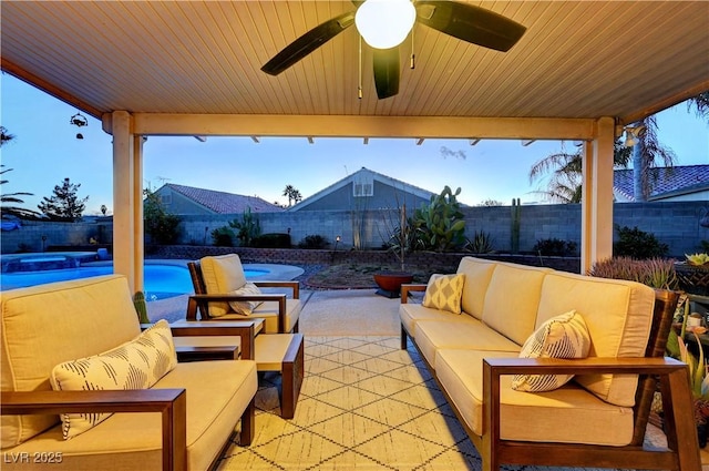 view of patio / terrace with an outdoor living space, a fenced in pool, and ceiling fan