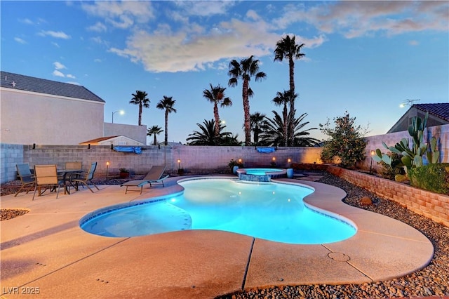 view of pool featuring an in ground hot tub and a patio area