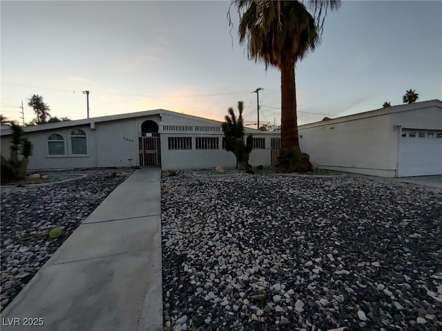 single story home with a garage