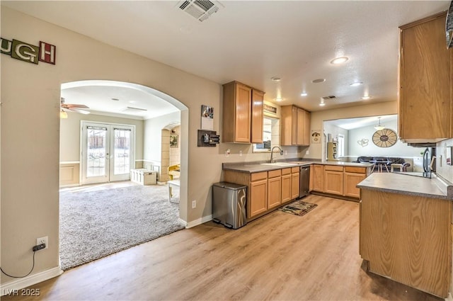 kitchen featuring light wood-type flooring, french doors, dishwasher, and sink