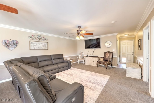 carpeted living room featuring crown molding and ceiling fan