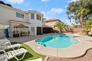 view of swimming pool with a patio and a gazebo