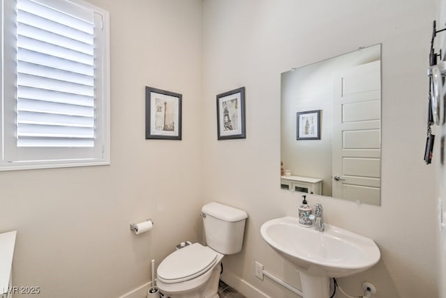 bathroom with sink and toilet