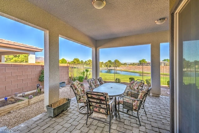 view of patio / terrace featuring a water view