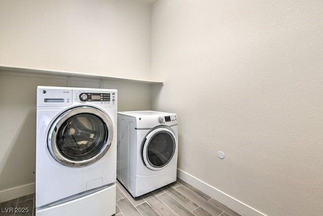 clothes washing area featuring washing machine and dryer