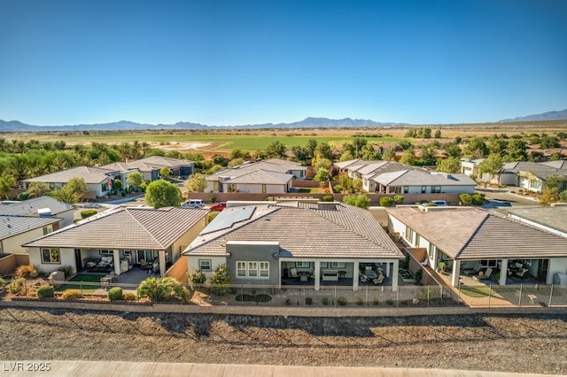 drone / aerial view featuring a mountain view