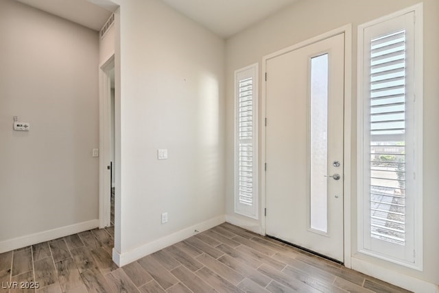 foyer with light hardwood / wood-style floors