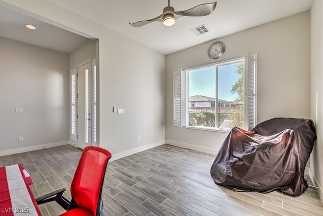 living area with ceiling fan