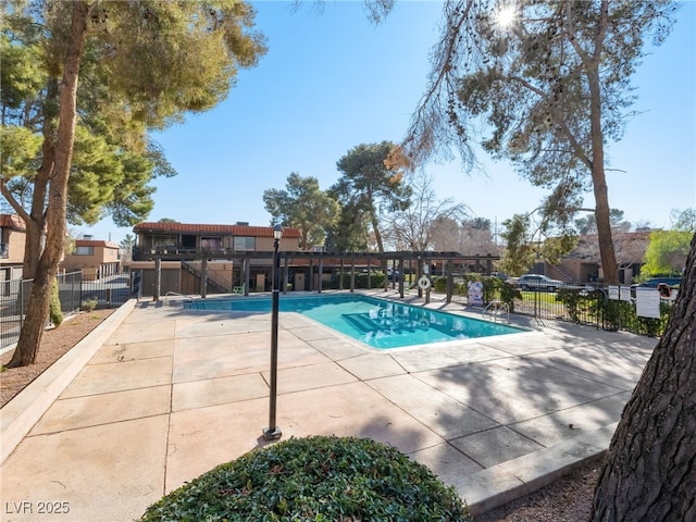 view of swimming pool featuring a patio area