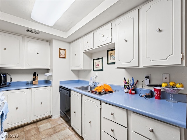 kitchen featuring sink, dishwasher, range, and white cabinets