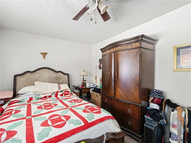 bedroom with a textured ceiling and ceiling fan