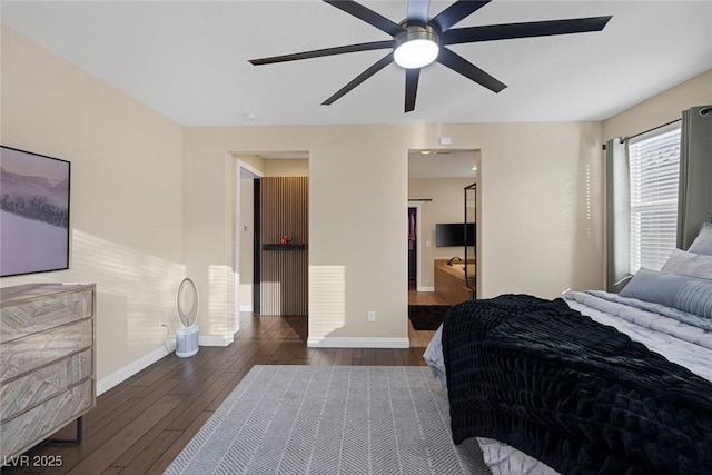 bedroom with ceiling fan, wood-type flooring, and baseboards