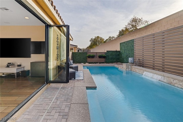 view of pool with fence and a fenced in pool