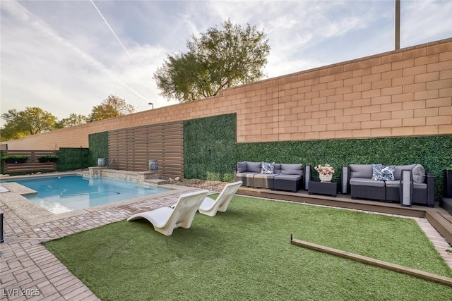 view of pool featuring a fenced backyard and an outdoor living space