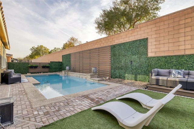 view of pool with a fenced backyard, an outdoor living space, a fenced in pool, and a patio