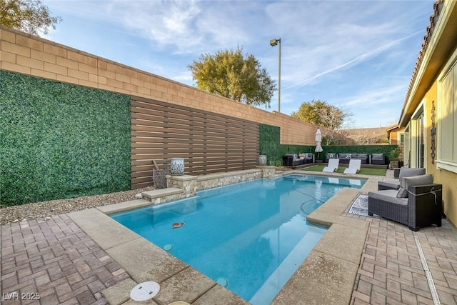 view of swimming pool with a fenced in pool, a patio area, and a fenced backyard