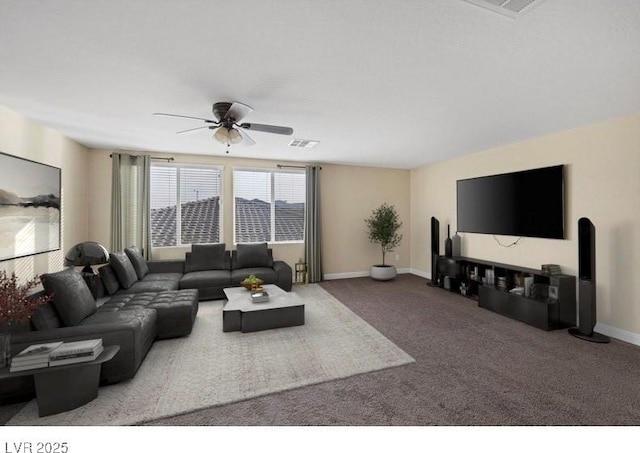 carpeted living area with ceiling fan and baseboards