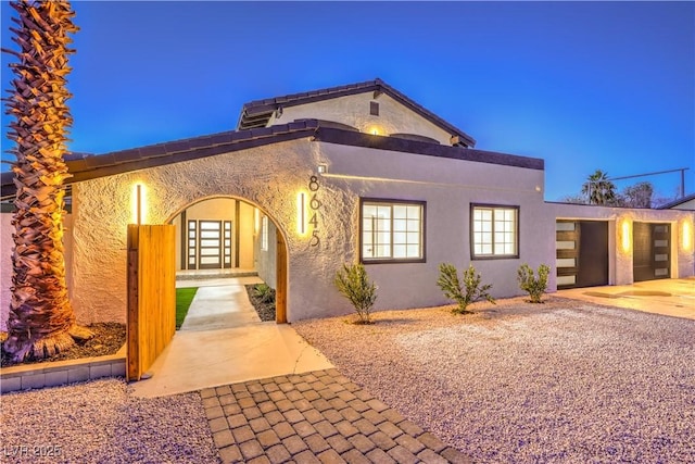 mediterranean / spanish-style house featuring a garage