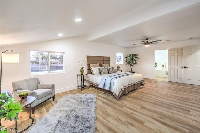 bedroom with ceiling fan, lofted ceiling, and light hardwood / wood-style floors