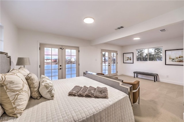 carpeted bedroom featuring french doors and access to exterior