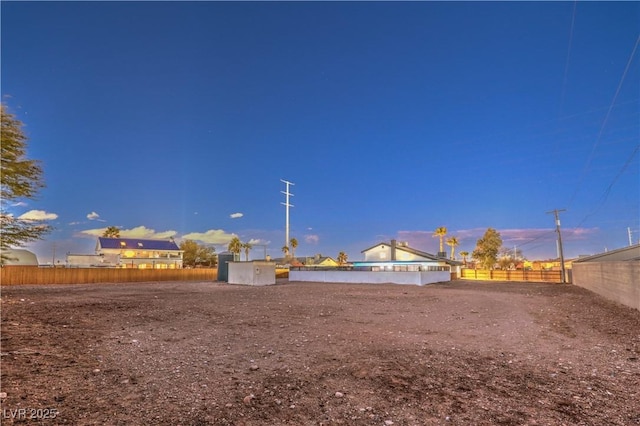 view of yard at dusk