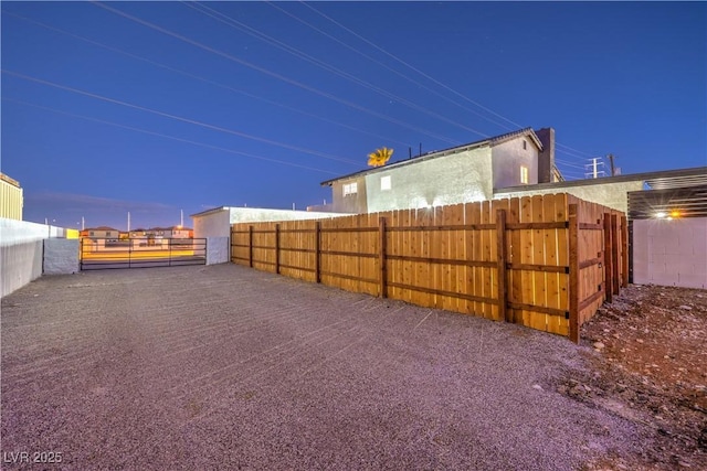 view of yard at dusk