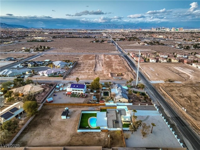 drone / aerial view featuring a mountain view