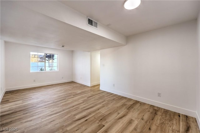 unfurnished room with light hardwood / wood-style floors