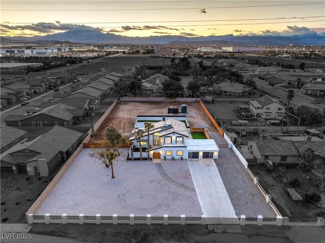 aerial view at dusk with a mountain view