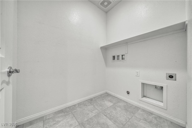 washroom with laundry area, baseboards, hookup for a gas dryer, and electric dryer hookup