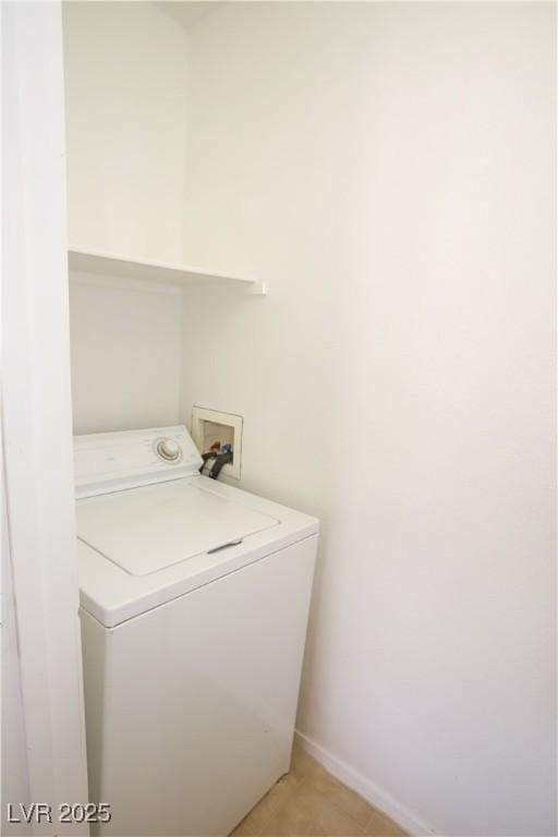 washroom with washer / dryer