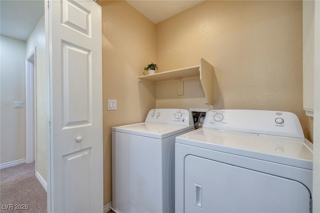 washroom featuring separate washer and dryer and light colored carpet