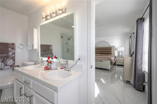 bathroom with vanity, toilet, and a shower with shower door