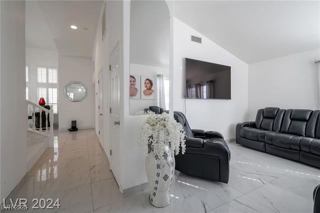 living room with lofted ceiling