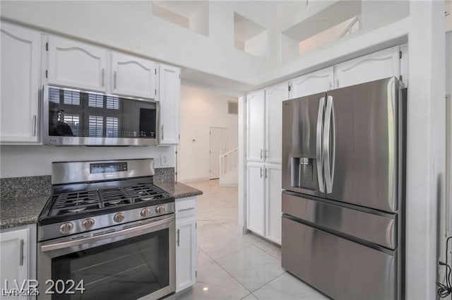 kitchen featuring white cabinets and appliances with stainless steel finishes