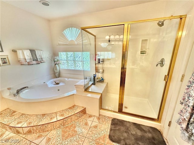 bathroom with a stall shower, tile patterned flooring, and a bath