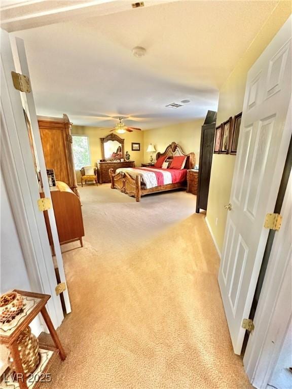 bedroom with visible vents and light colored carpet