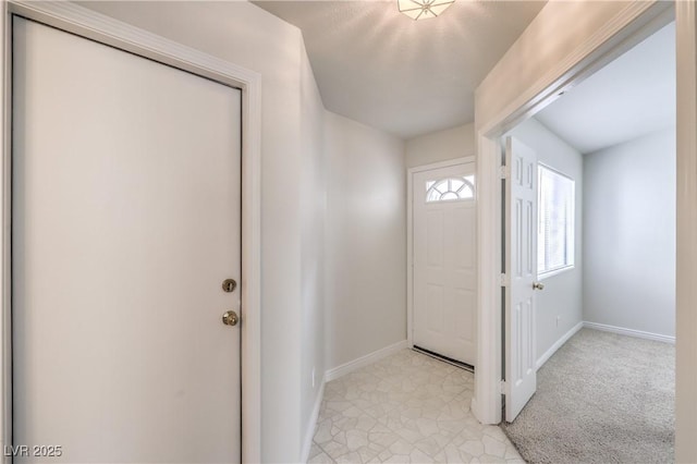 entrance foyer featuring baseboards