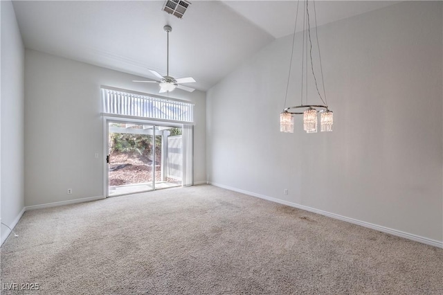 carpeted empty room with a ceiling fan, lofted ceiling, visible vents, and baseboards