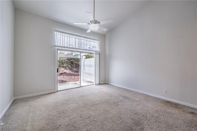 empty room with carpet floors, ceiling fan, high vaulted ceiling, and baseboards